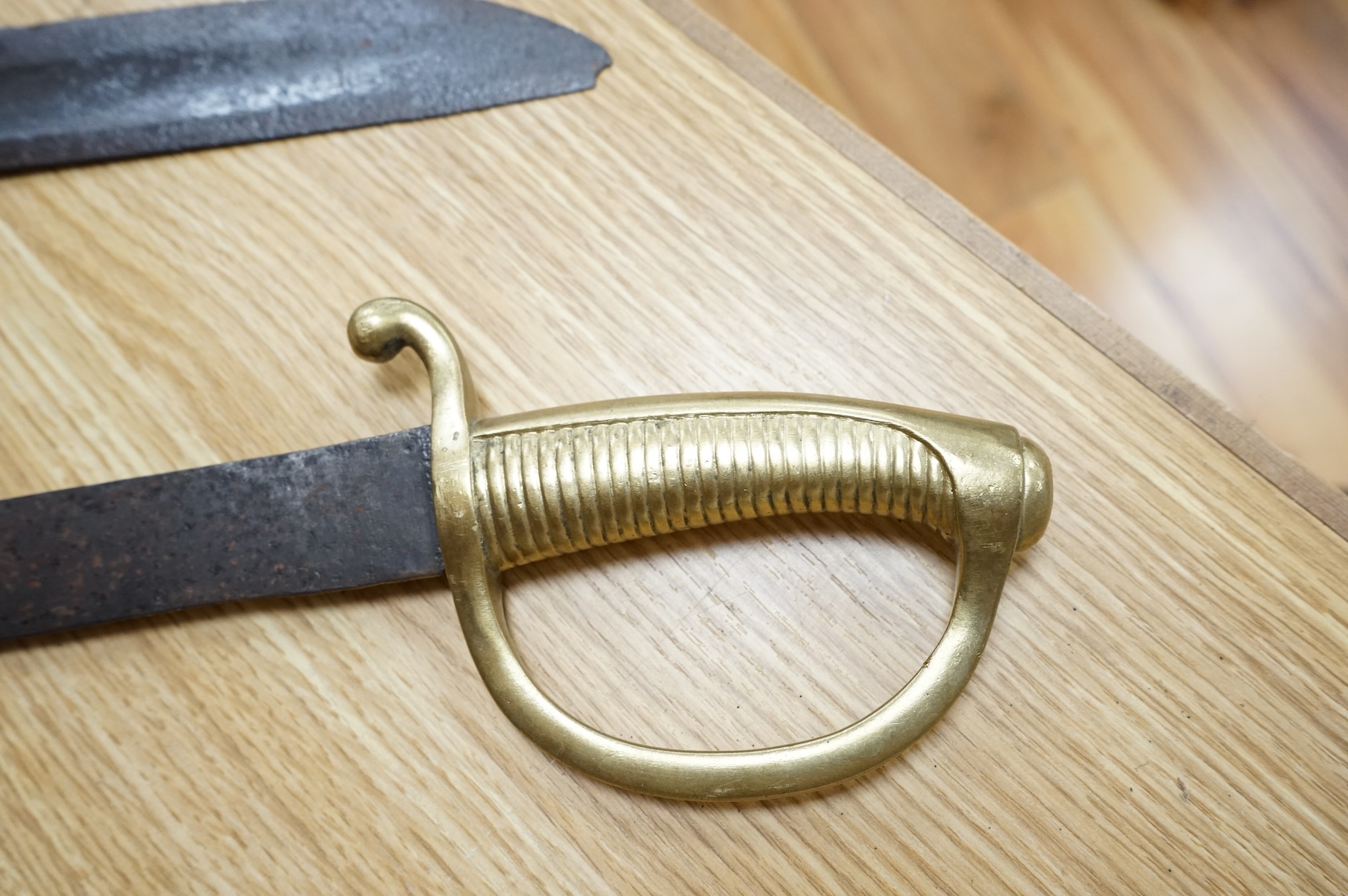 A mid 19th century infantryman’s short sword Gladius with cast brass hilt of universal pattern, stamped 306, together with two Continental infantyman’s side arm briquet, one stamped; M. and R. Boker Remscheid (3)